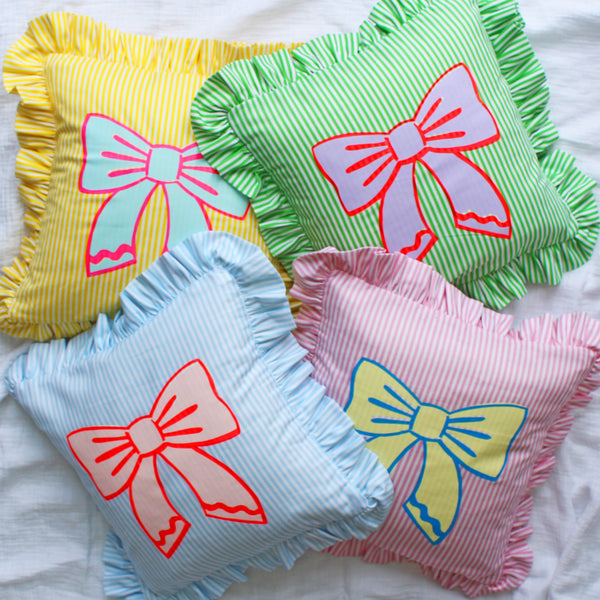 Frilled striped bow cushion