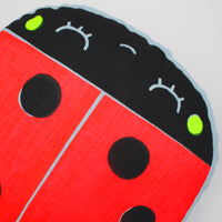 Screen printed ladybird cushion