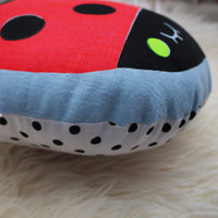Screen printed ladybird cushion